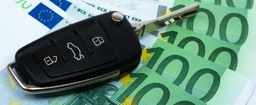 Car key on money background. Car key on money background.